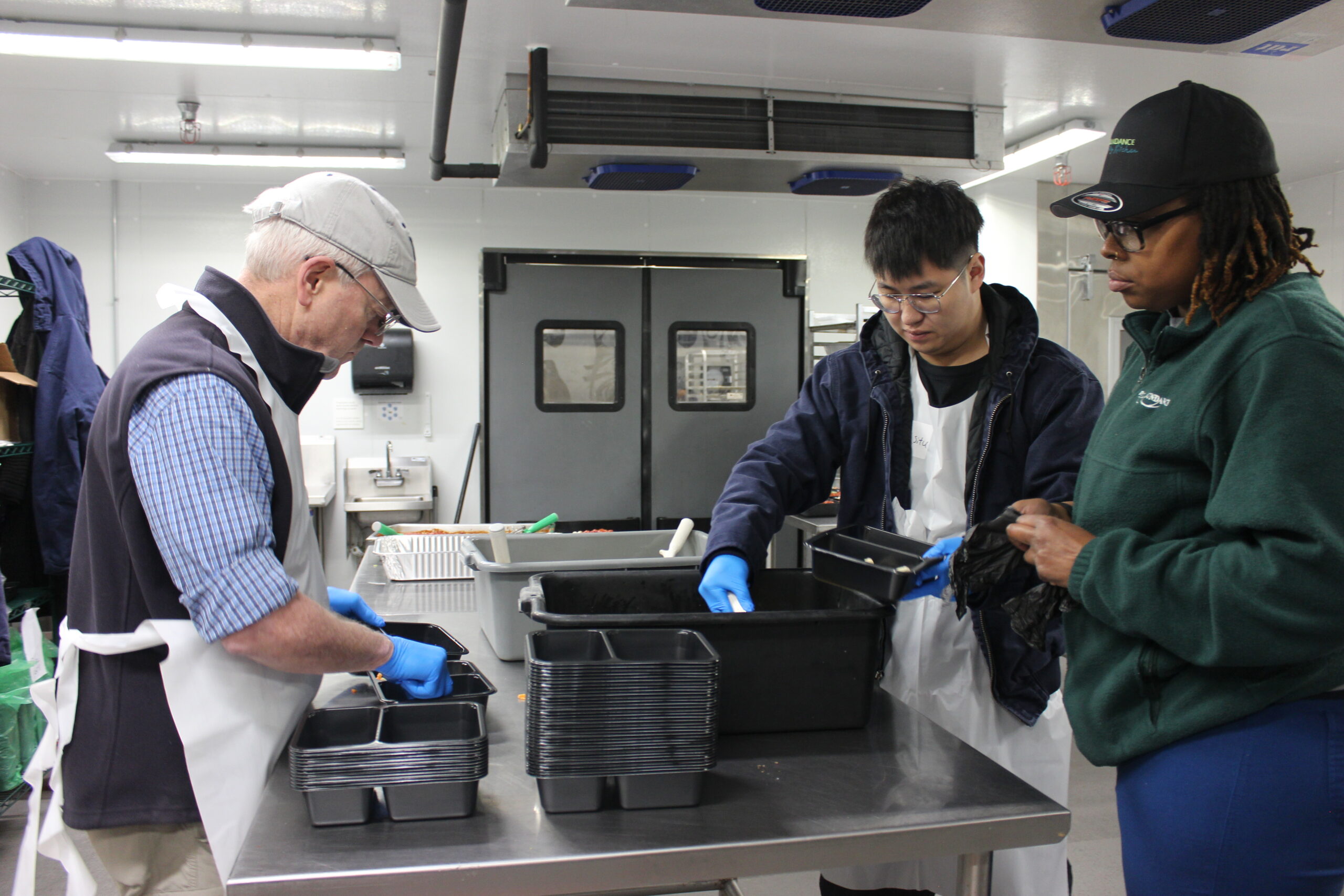 Philabundance Community Kitchen Volunteers packing meal boxes | volunteer | food drive