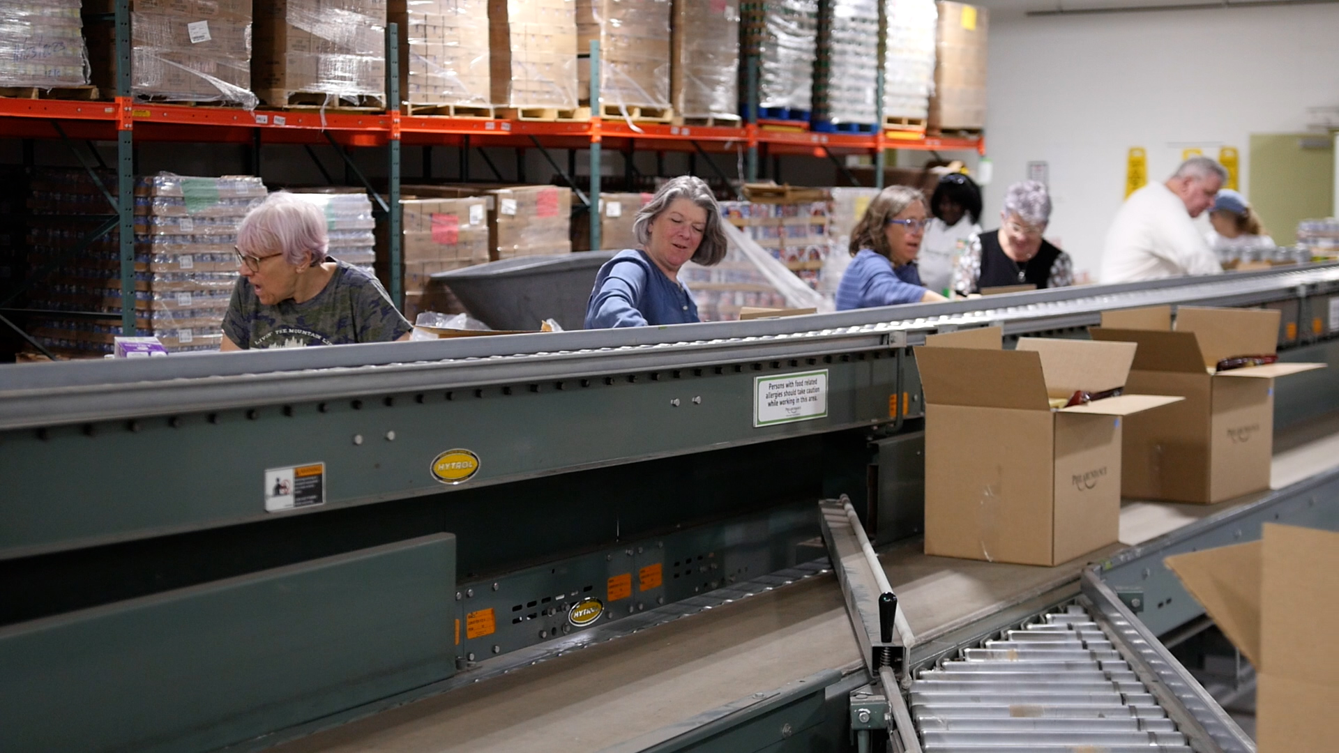 Volunteers packing food donation boxes | Galloway | warehouse